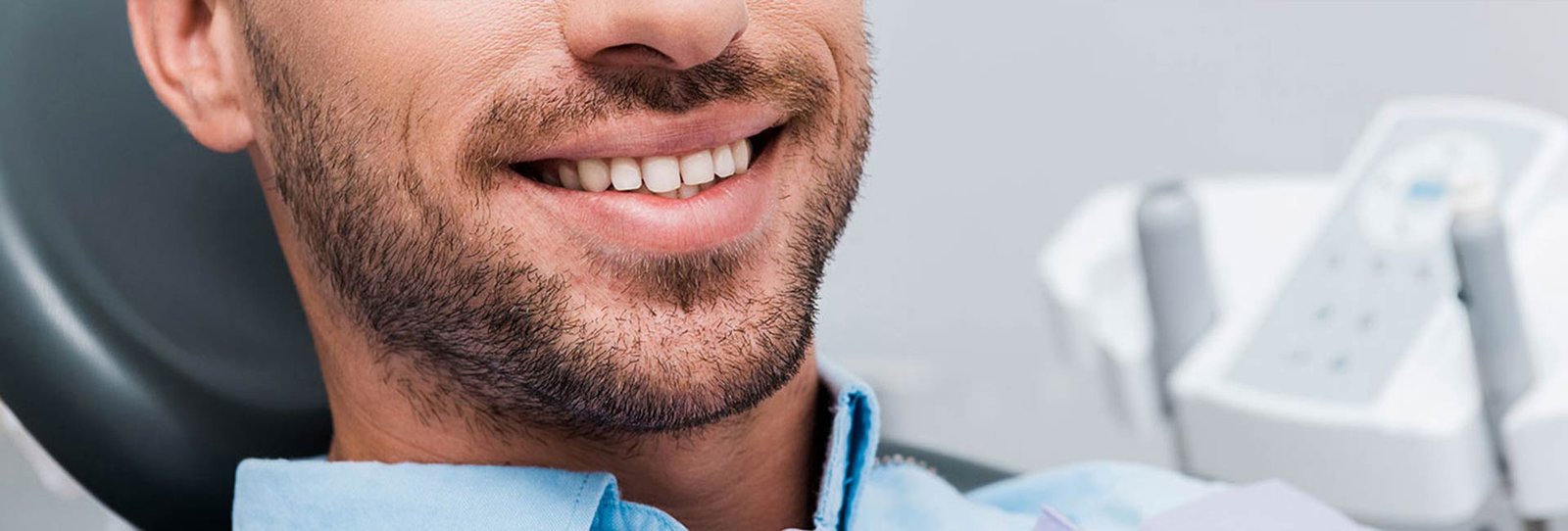 Close up of a man's smile at the dentist office