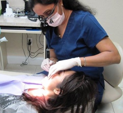 Doctor Ponnagantic treating dental patient
